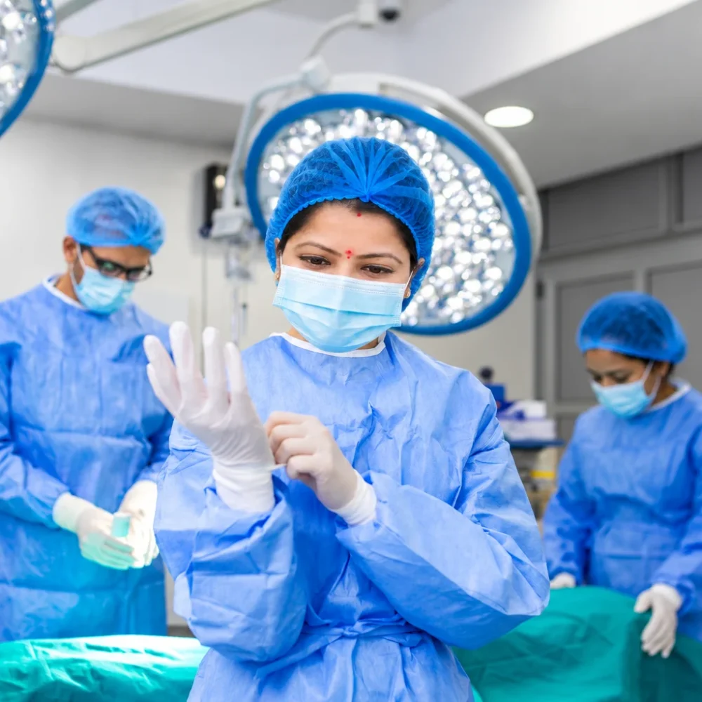 Indian Surgeon Preparing Gloves